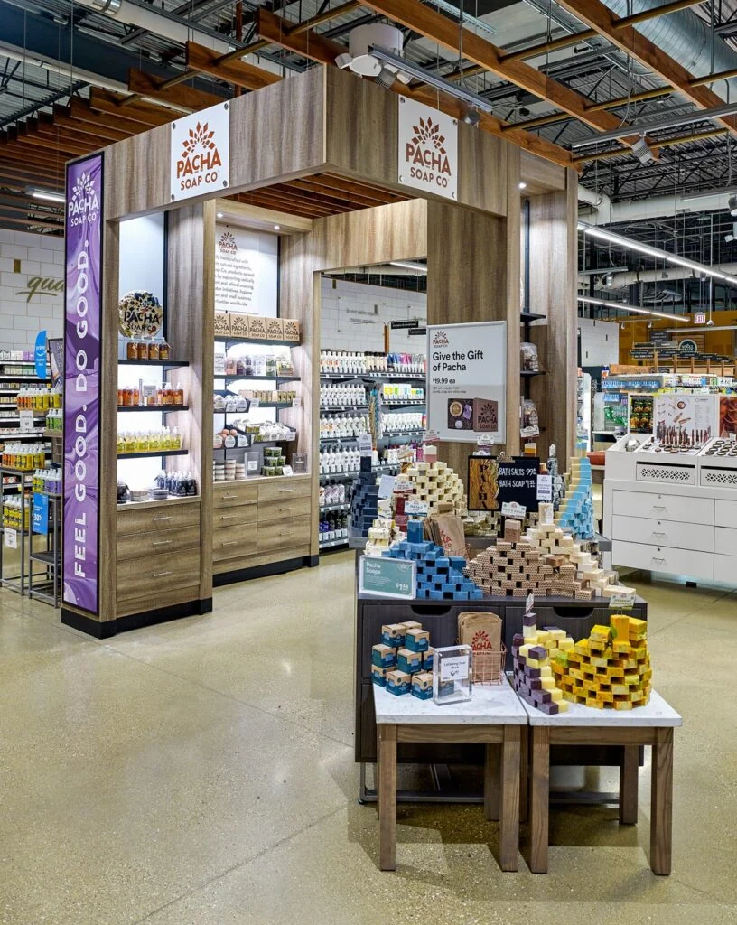 A store filled with lots of fresh produce with illuminated shelving